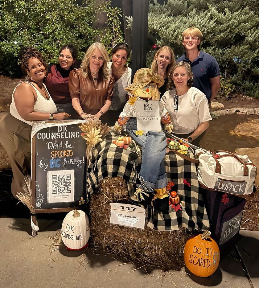 The DK Counseling team gathered around their scarecrow, Ms. Thinks-A-Lot, at the 21st Annual Scarecrow Harvest in Alpharetta